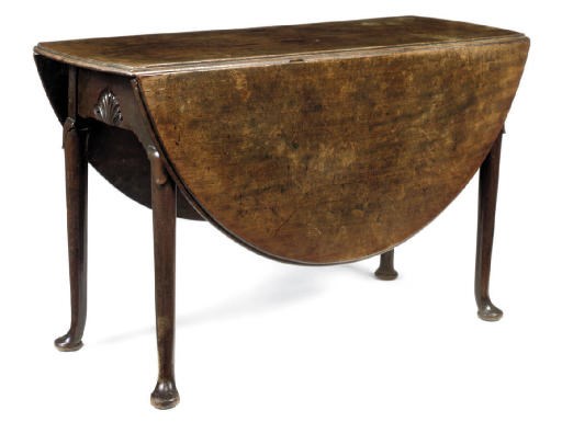 A GEORGE II MAHOGANY DROP-LEAF DINING TABLE