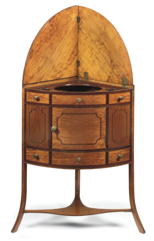 A REGENCY SATINWOOD AND MAHOGANY CROSSBANDED CORNER WASHSTAND