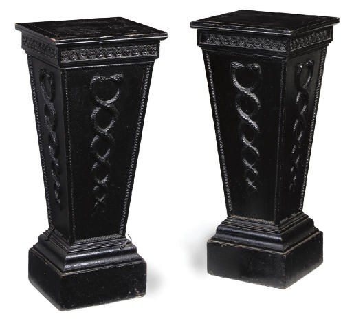 A PAIR OF LATE GEORGE III BLACK-PAINTED PINE AND COMPOSITION PEDESTALS