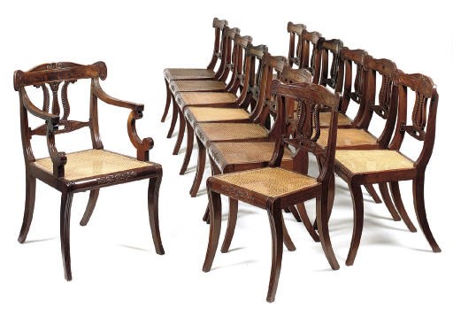A SET OF FOURTEEN REGENCY MAHOGANY DINING CHAIRS