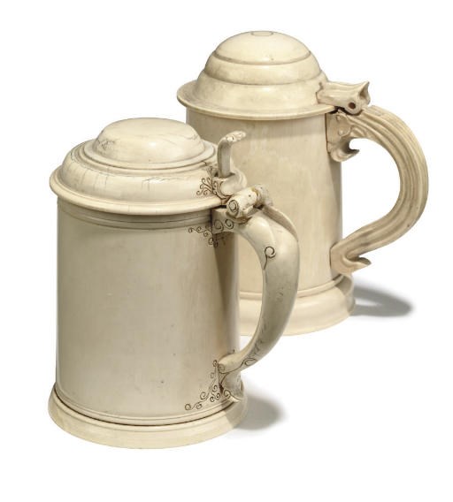 TWO CONTINENTAL IVORY LIDDED TANKARDS