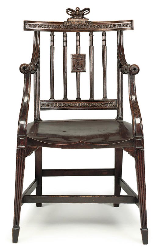 A GEORGE III OAK ARMCHAIR