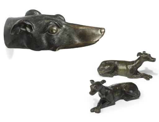 A PAIR OF FRENCH BRONZE MODELS OF RECLINING GREYHOUNDS