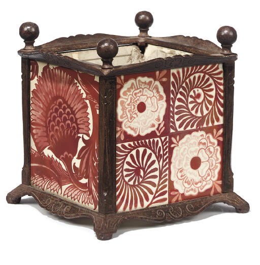 A CAST IRON JARDINIÈRE INSET WITH 'ROSE AND SCROLL' AND 'BBB' RUBY LUSTRE TILES DESIGNED BY WILLIAM DE MORGAN