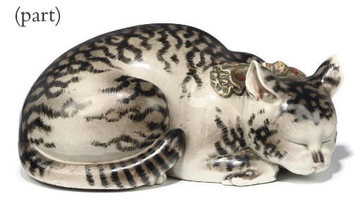 A JAPANESE PORCELAIN MODEL OF A CAT