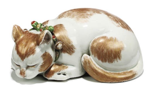 A JAPANESE PORCELAIN MODEL OF A CAT