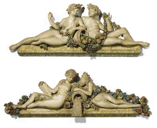 A PAIR OF NORTH ITALIAN POLYCHROME-DECORATED OVERDOOR CARVINGS