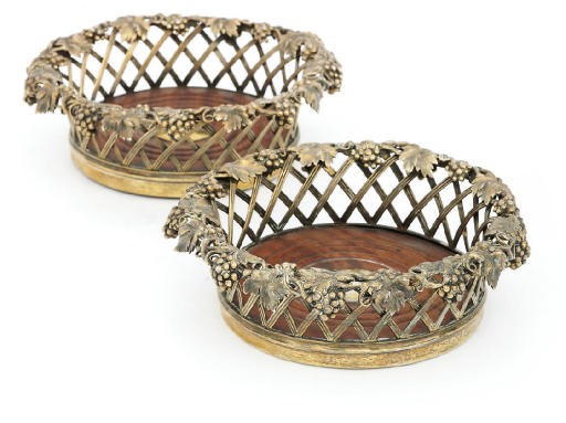 A PAIR OF SILVER-GILT WINE COASTERS