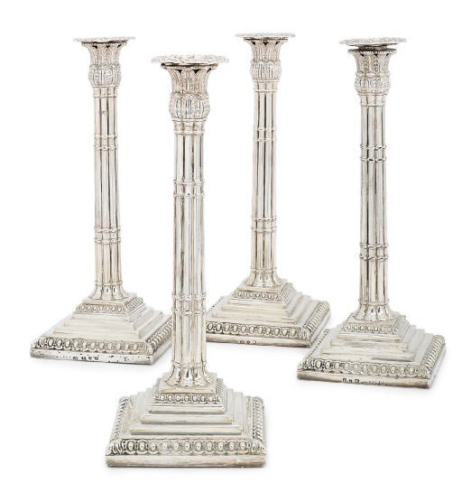 A SET OF FOUR GEORGE III SILVER CANDLESTICKS