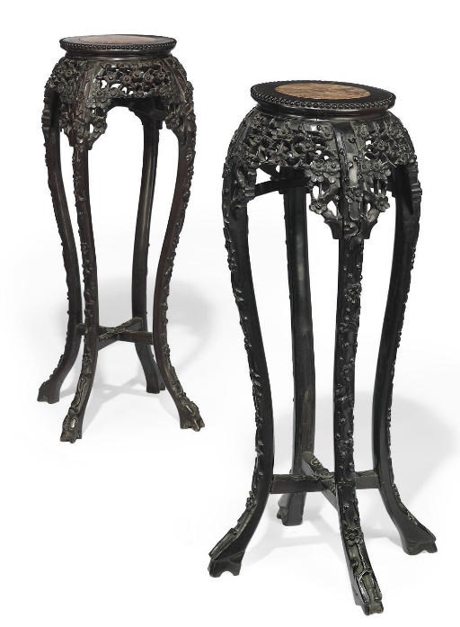 A PAIR OF CHINESE EBONISED HARDWOOD URN STANDS