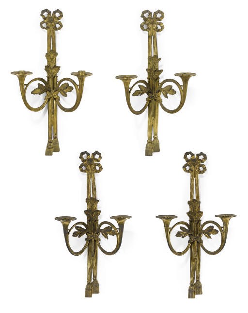 A SET OF FOUR LOUIS XVI STYLE ORMOLU TWO-LIGHT APPLIQUÉS