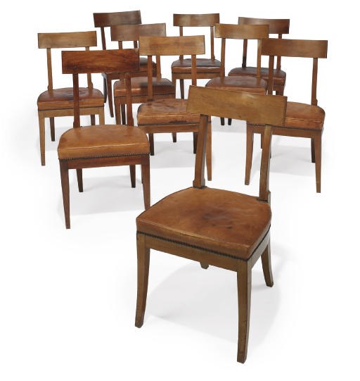 A HARLEQUIN SET OF NINETEEN DIRECTOIRE WALNUT SIDE CHAIRS