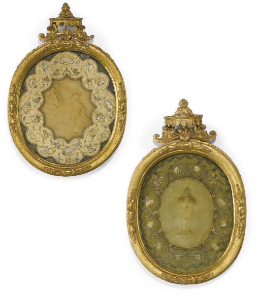 A PAIR OF ITALIAN OVAL WAX PORTRAITS OF ST. PHILIP AND ST. FRANCIS