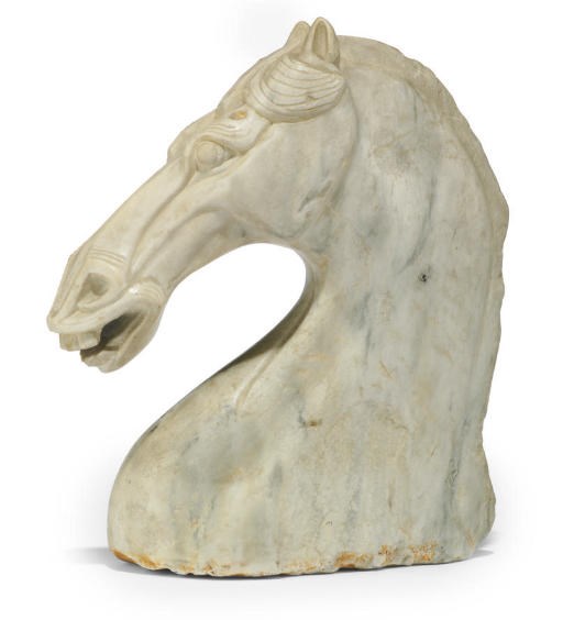 A CARVED MARBLE MODEL OF A HORSE'S HEAD