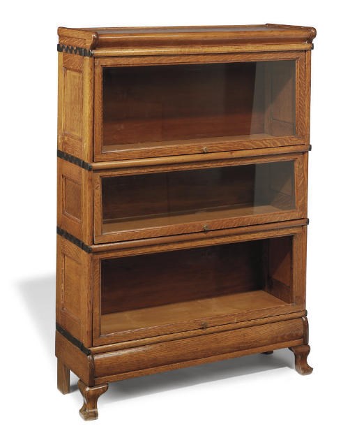 A METAL-BANDED OAK THREE SECTION BOOKCASE CABINET