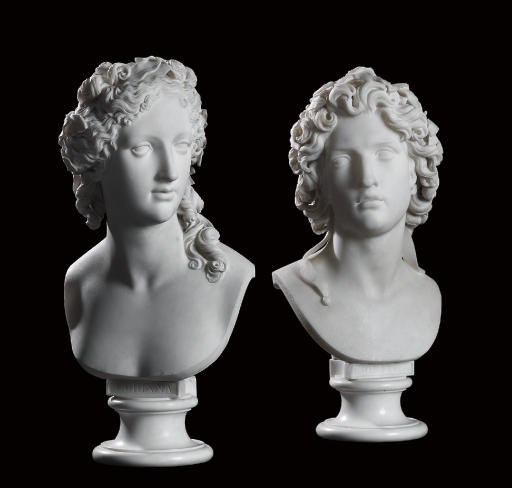 A PAIR OF ITALIAN CARVED WHITE MARBLE BUSTS OF ORFEO AND CORINNA