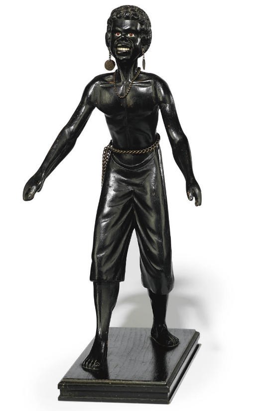 AN ITALIAN EBONISED CARVED WOOD MODEL OF A BLACKAMOOR