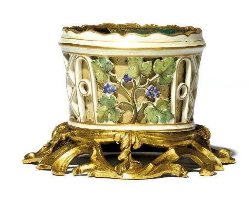AN ORMOLU-MOUNTED CONTINENTAL PORCELAIN CACHE-POT