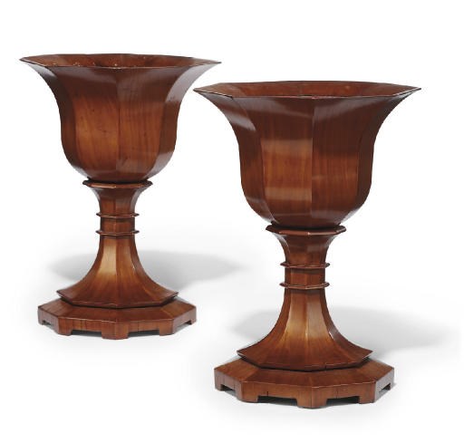 A PAIR OF ITALIAN FRUITWOOD OCTAGONAL FACETED URNS
