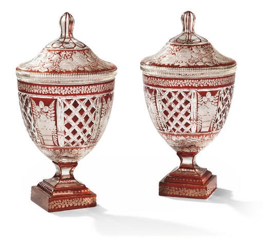 A PAIR OF CONTINENTAL RUBY-STAINED AND CLEAR GLASS VASES AND COVERS