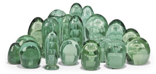 SEVENTEEN VARIOUS GREEN GLASS 'DUMP' WEIGHTS