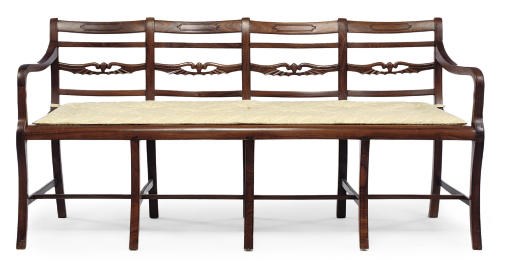AN ANGLO-INDIAN PADOUK FOUR CHAIR-BACK SETTEE