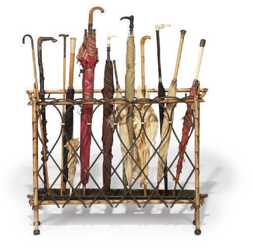 A CAST-IRON AND POLYCHROME DECORATED FAUX BAMBOO AND WICKER UMBRELLAS STAND