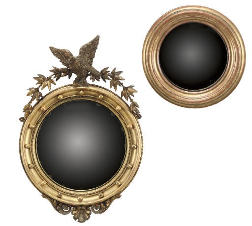 A LATE VICTORIAN GILTWOOD AND GILT-COMPOSITION CIRCULAR CONVEX MIRROR