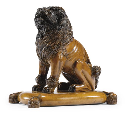 A FRENCH CARVED FRUITWOOD MODEL OF A PUG DOG INKWELL