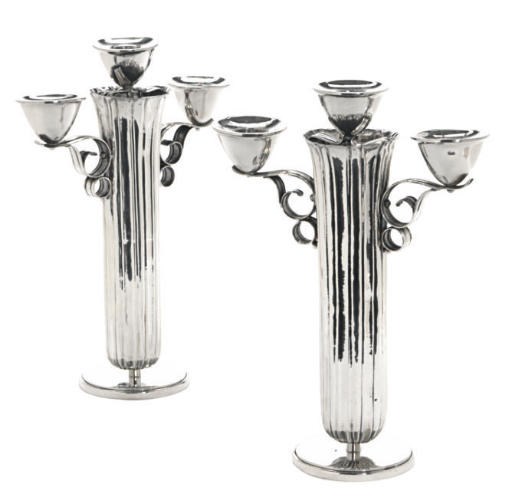 A PAIR OF CONTINENTAL SILVER-PLATED CANDLEABRA,