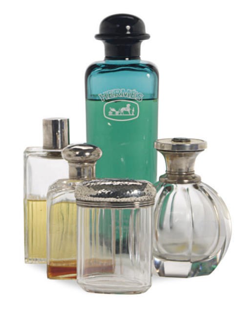 A GROUP OF SEVEN SILVER-MOUNTED GLASS BOTTLES,