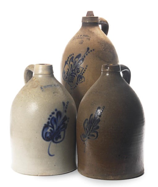 THREE AMERICAN STONEWARE TWO GALLON JUGS WITH FLORAL DECORATION,