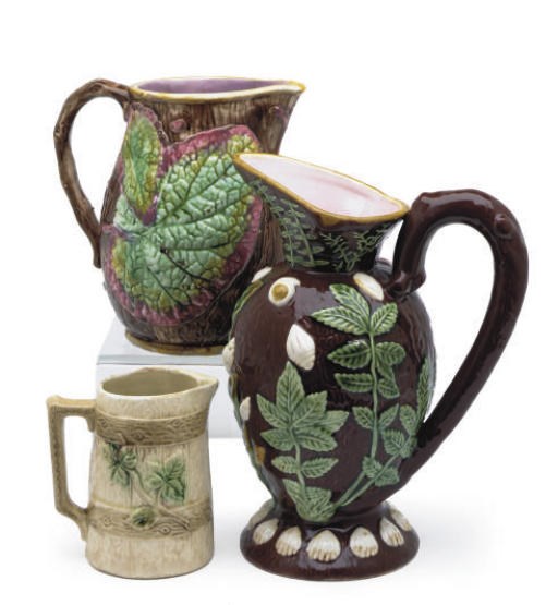 A GROUP OF SEVEN MAJOLICA PITCHERS,
