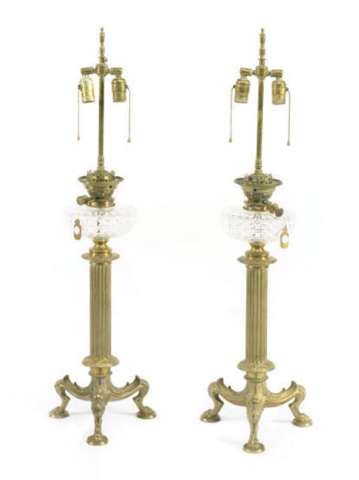 A PAIR OF AMERICAN GILT-BRONZE AND CUT-GLASS FLUID LAMPS,