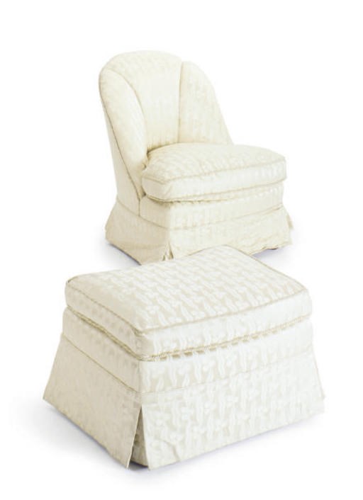 AN UPHOLSTERED SLIPPER CHAIR AND MATCHING OTTOMAN,