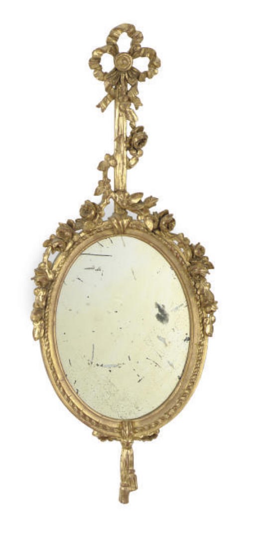 A CARVED GILTWOOD MIRROR,
