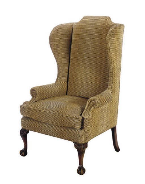AN ENGLISH CARVED MAHOGANY WINGBACK ARMCHAIR,