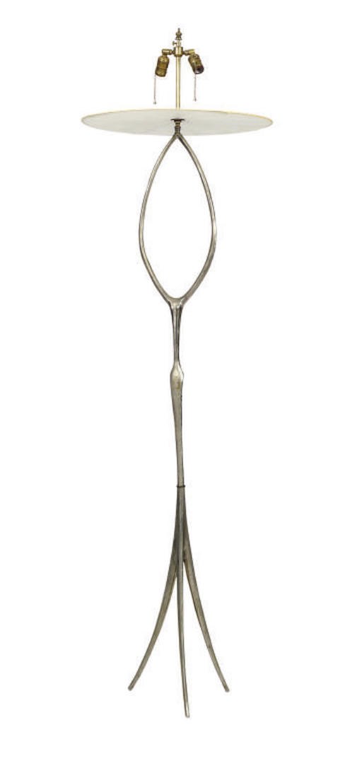 A SILVERED METAL FLOOR LAMP,