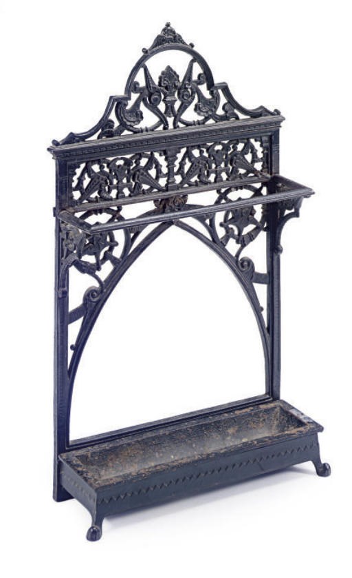 AN IRON UMBRELLA STAND AND DRIP TRAY,