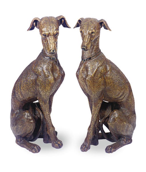 A PAIR OF BLACK FOREST CARVED HOUNDS,
