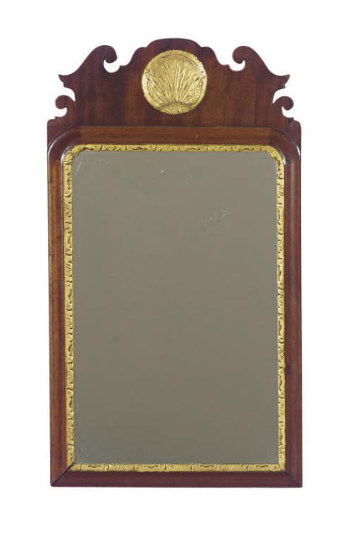 AN AMERICAN MAHOGANY AND PARCEL-GILT MIRROR,