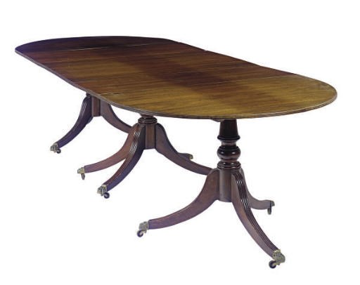 AN ENGLISH MAHOGANY TRIPLE-PEDESTAL DINING TABLE,