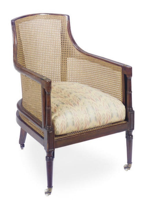 A REGENCY MAHOGANY AND CANED LIBRARY BERGERE,