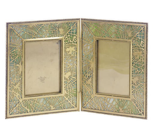 AN AMERICAN GILT-BRONZE AND FAVRILE GLASS 'PINE NEEDLE' PATTERN TWIN PANEL PHOTOGRAPH FRAME,