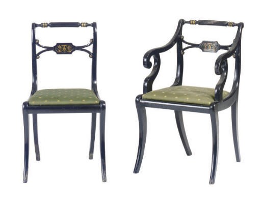 A SET OF EIGHT REGENCY STYLE BRASS-MOUNTED EBONIZED DINING CHAIRS,