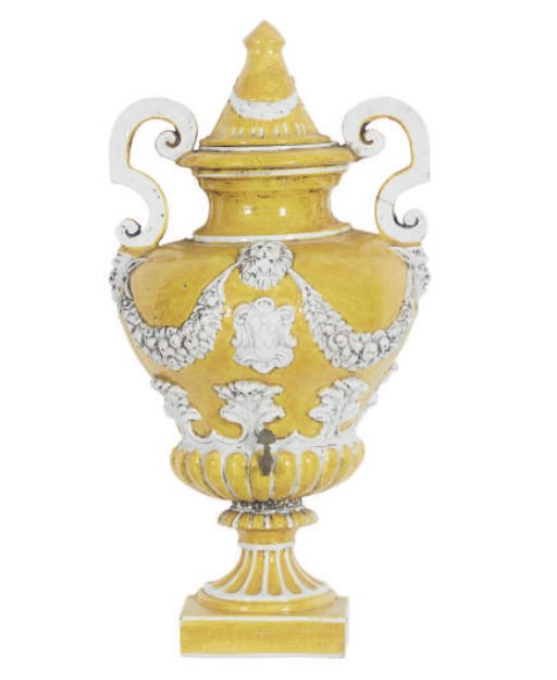 A TERRACOTTA YELLOW AND WHITE-GLAZED LAVABO WITH COVER,
