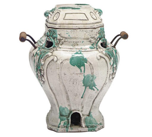 A CONTINENTAL FAIENCE PORTABLE STOVE AND COVER,