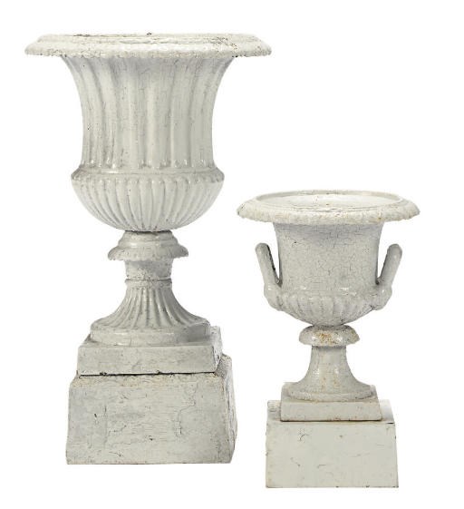 A PAIR OF WHITE-PAINTED CAST IRON GARDEN URNS ON STANDS,