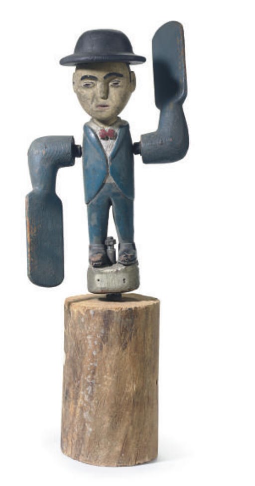 A CARVED AND PAINT-DECORATED WHIRLIGIG