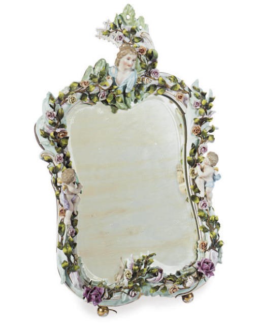 A CONTINENTAL PORCELAIN VANITY MIRROR,